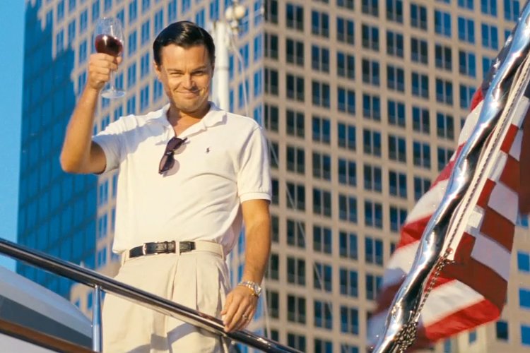 Bottoms up! Jordan Belfort living the American dream and toasting the FBI with a cheeky glass of Chateau Margaux.