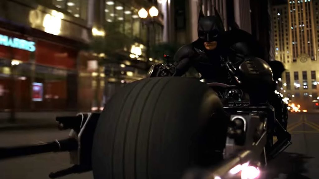 The Dark Knight - or The Batman - on ihs Batbike, or mobile, or something.