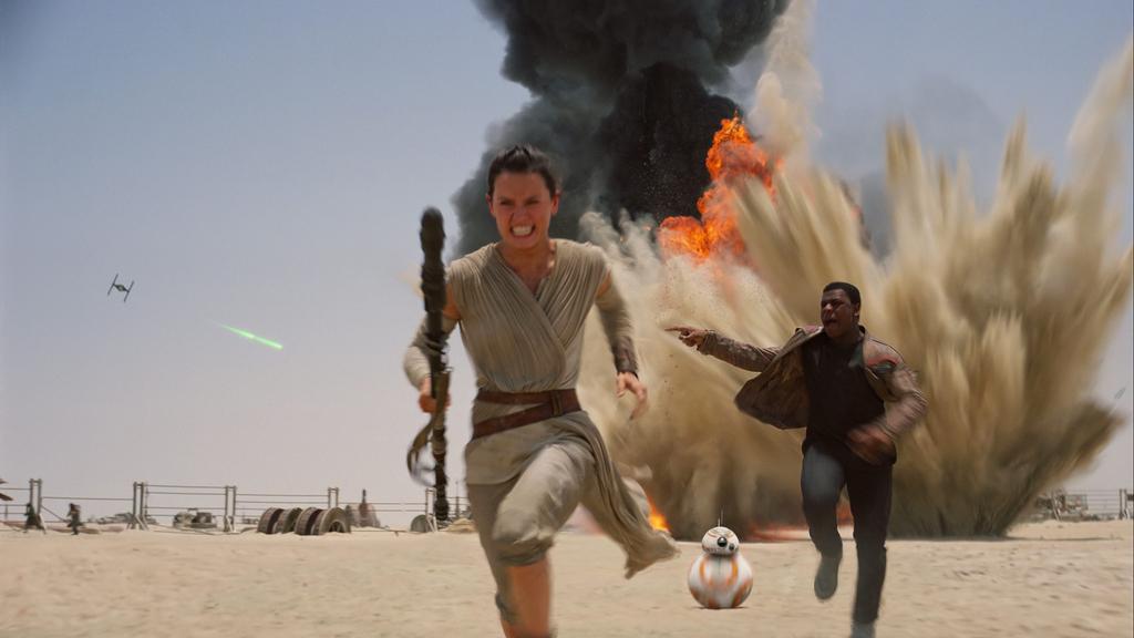 Rey and Finn run from the First Order in The Force Awakens, the best Star Wars film in the recent trilogy.