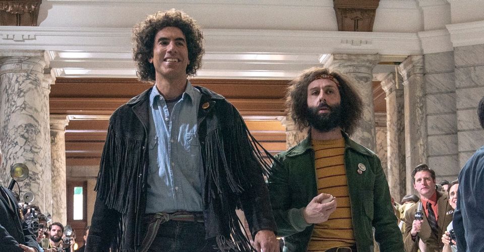 Sacha Baron Cohen as Abbie Hoffman and Jeremy Strong as Jerry Rubin
