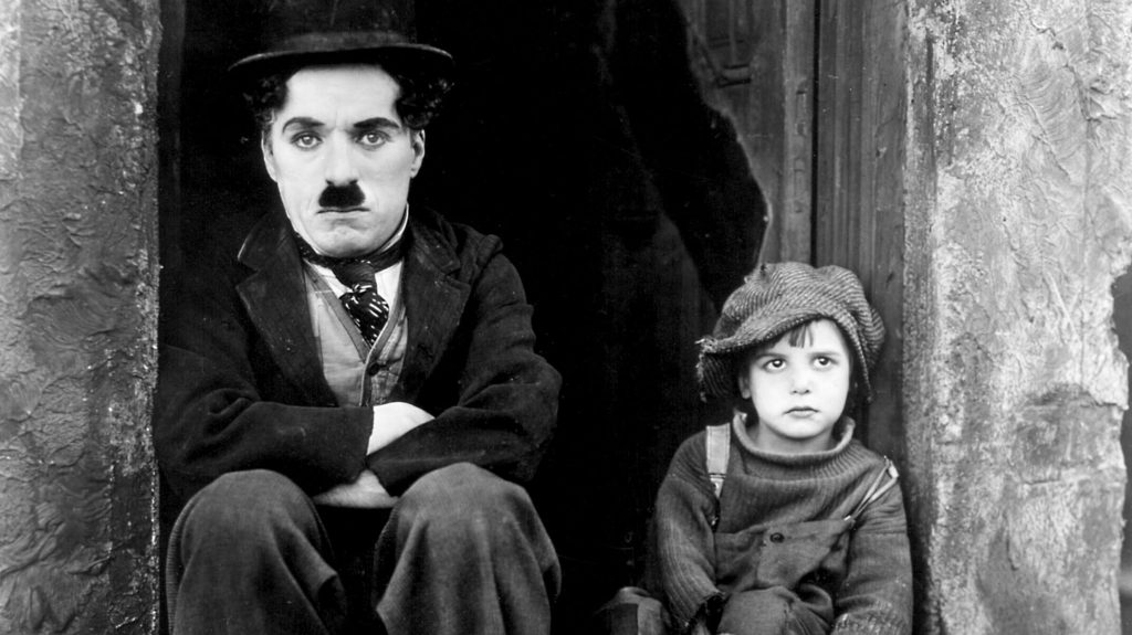 The Kid (1921) written and directed by Charlie Chaplin.