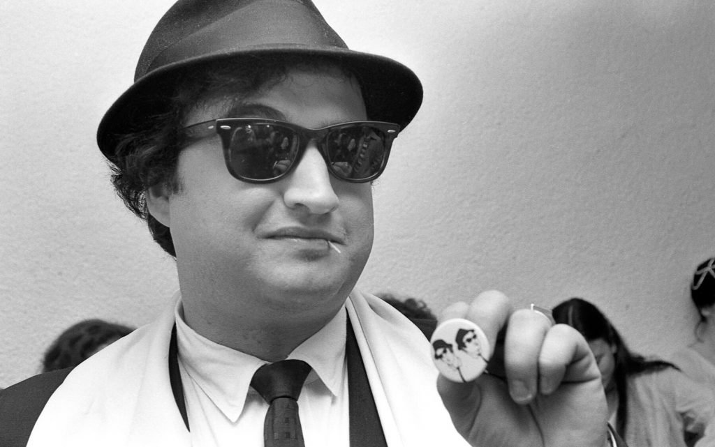 John Belushi as Jake Blues