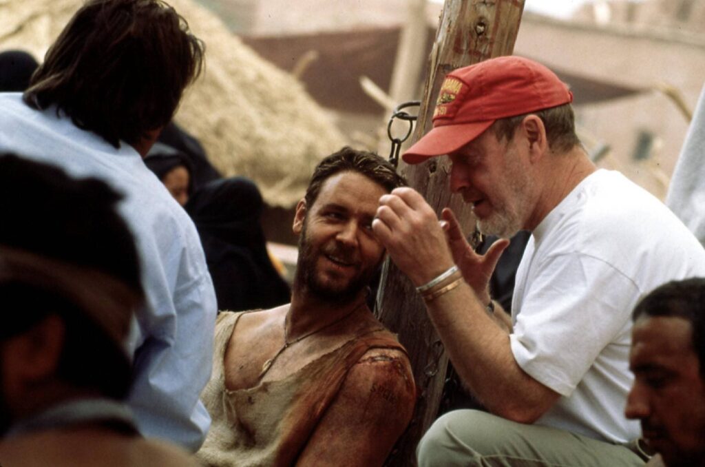 Ridley Scott and Russell Crowe share a moment on the set of Gladiator