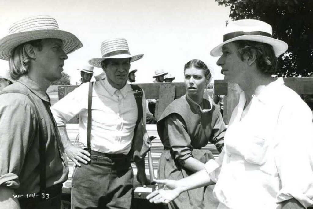 Alexander Godunov, Harrison Ford and Kelly McGillis with Peter Weir during the filming of Witness (1985)