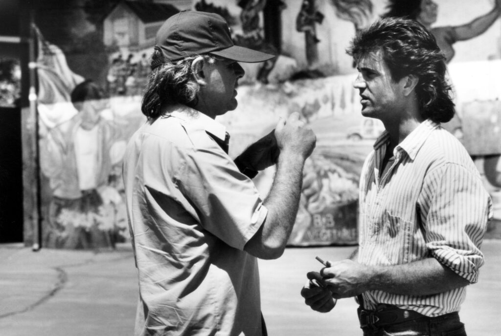 Richard Donner with Mel Gibson on the set of Lethal Weapon (1987)