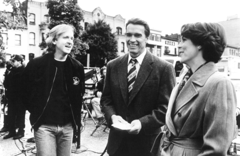 James Cameron with stars Arnold Schwarzenegger and Jamie Lee Curtis in the set of True Lies (1994)