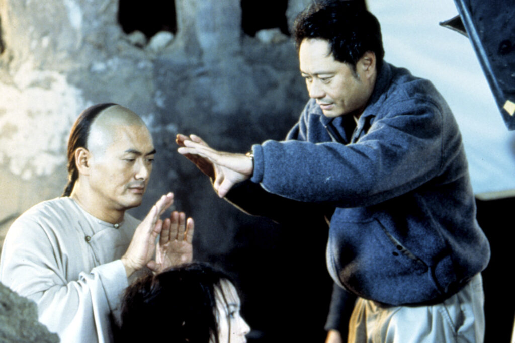 Chow Yun Fat and Ang Lee work on a scene during the filming of Crouching Tiger, Hidden Dragon (2000)