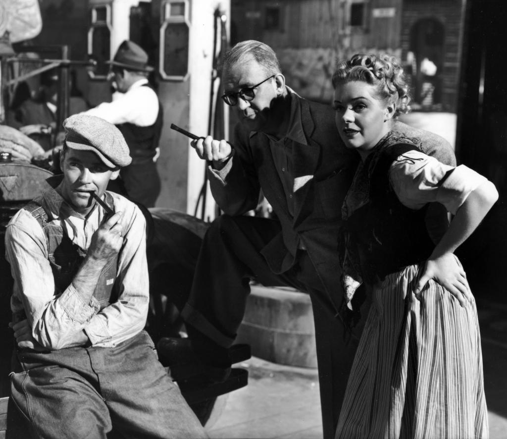 Henry Fonda, John Ford and Alice Faye on the set of The Grapes of Wrath (1940)