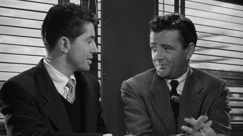  Bruno meets Guy at the start of Strangers on a Train (1951) 
