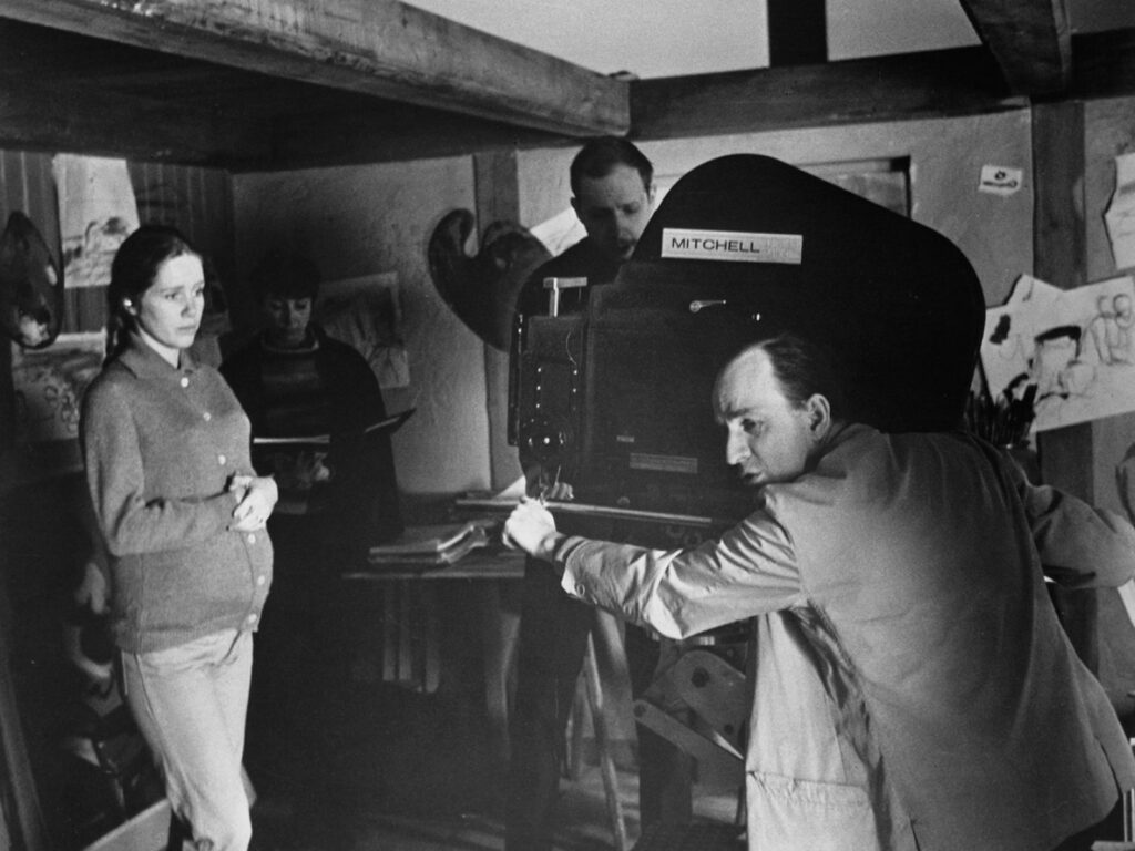 Liv Ullmann looks on as Ingmar Bergman prepares a shot  during the filming of Hour of the Wolf (1968)
