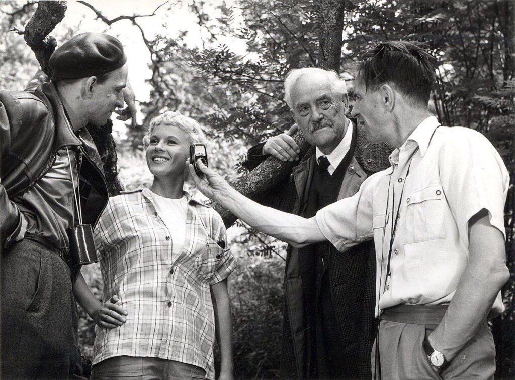 Ingmar Bergman with actors Bibi Andersson and Victor Sjöström as well as cinematographer Gunnar Fischer during the filming of Wild Strawberries (1957) 