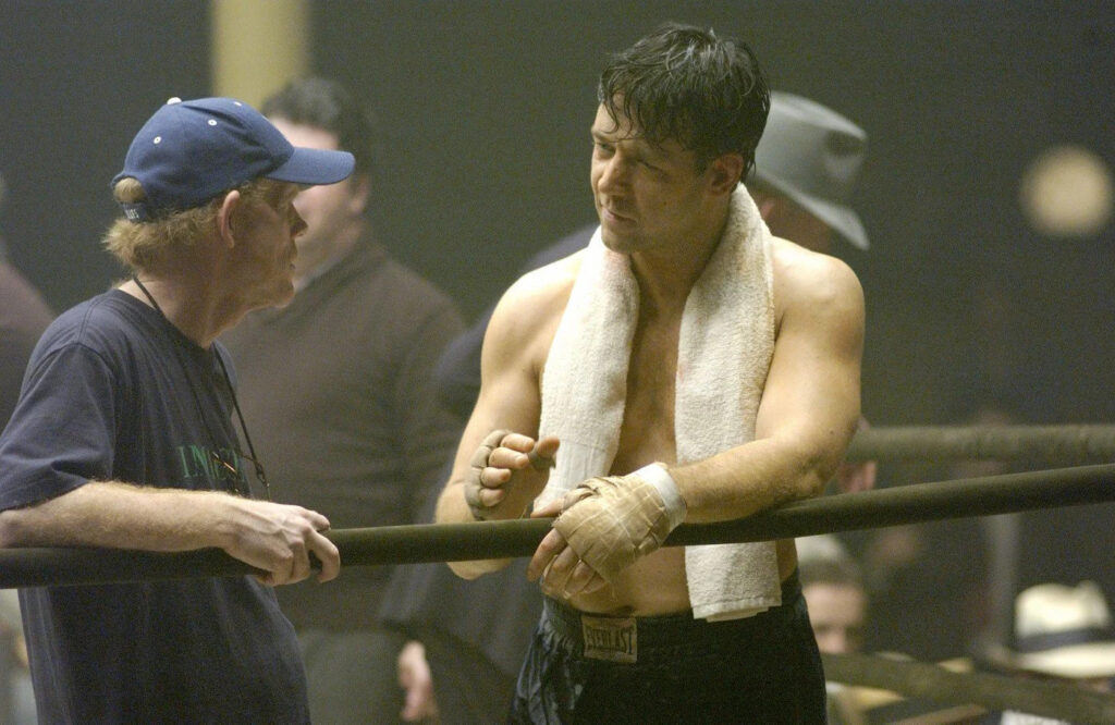 Ron Howard and Russell Crowe in between takes on the set of Cinderella Man (2005)