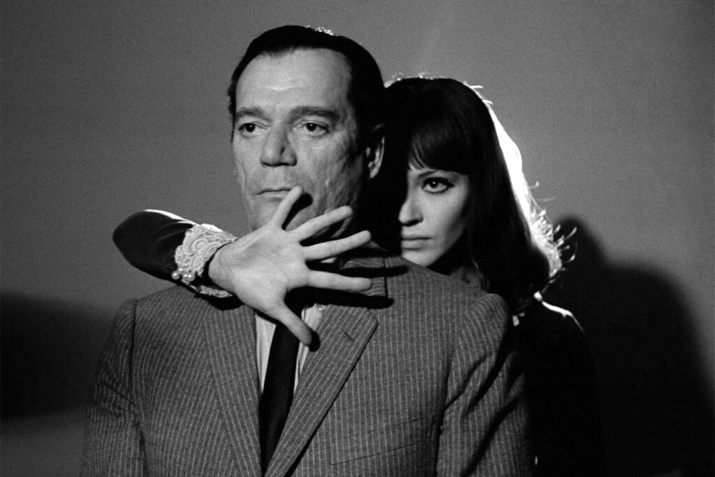 Eddie Constantine and Anna Karina in Alphaville (1965) directed by Jean-Luc Godard.