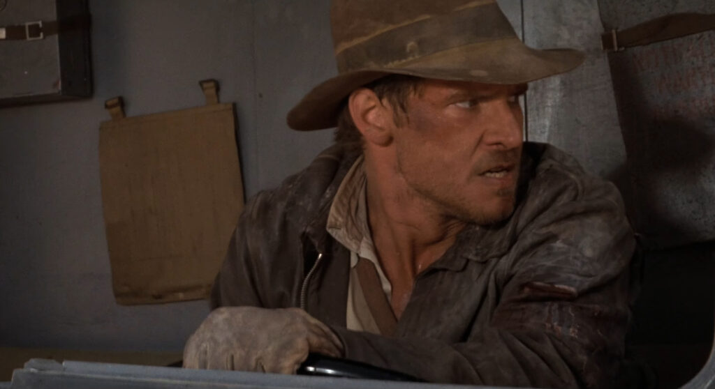 Harrison Ford in Raiders of the Lost Ark (1981) directed by Steven Spielberg.