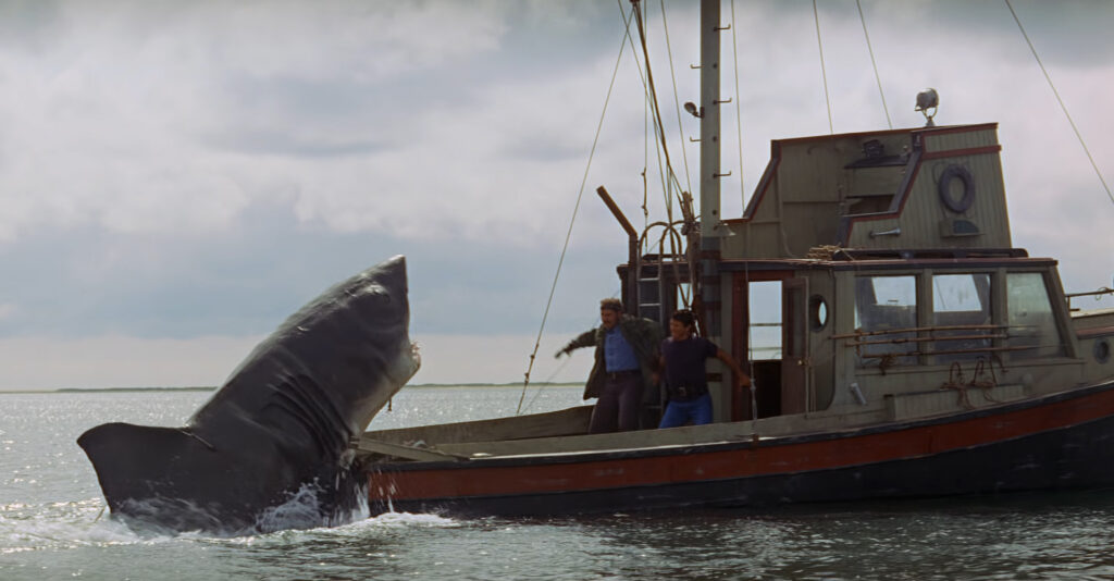  Jaws (1975) directed by Steven Spielberg.