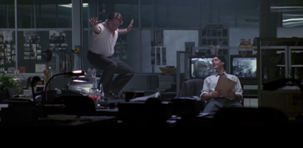 Gary Busey and Keanu Reeves in Point Break (1991) directed by Kathryn Bigelow.