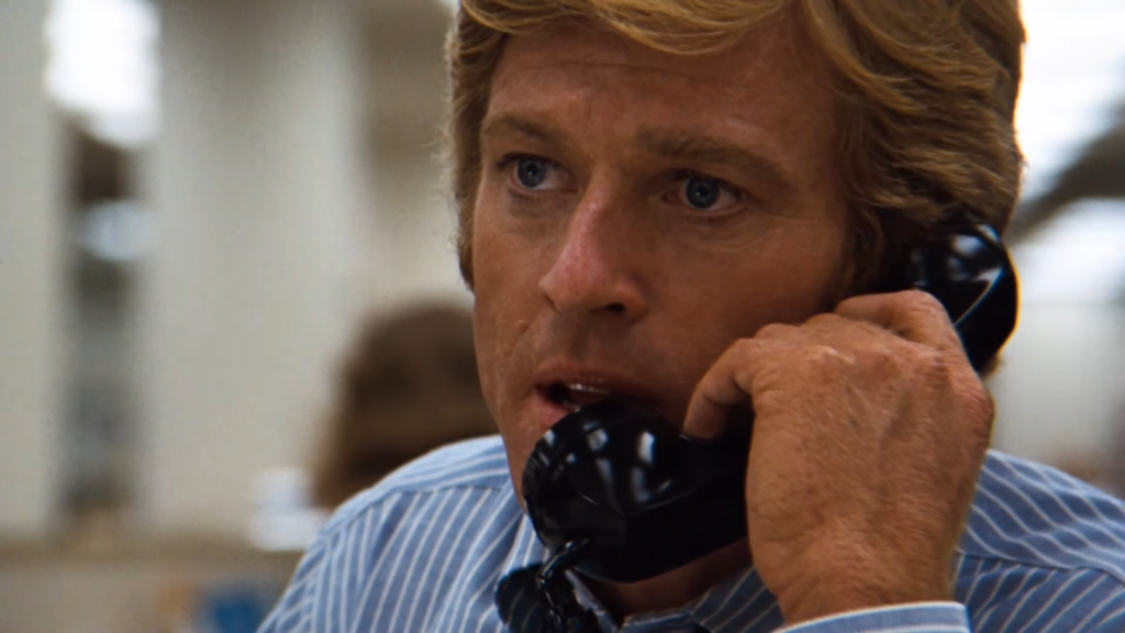Robert Redford in All the President's Men (1976) directed by Alan J. Pakula.