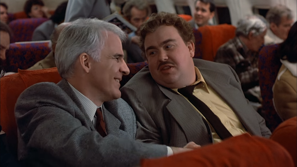 Steve Martin and John Candy in Planes, Trains and Automobiles (1987) directed by John Hughes.