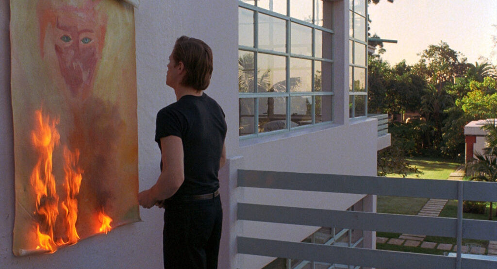 Willem Dafoe as Eric Masters, burns an abstract painting in To Live and Die in L.A. (1985)