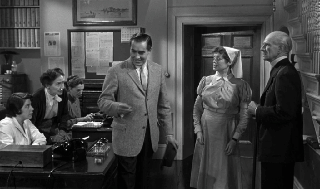 A scene from Witness for the Prosecution (1957) featuring Tyrone Power and Elsa Lanchester.