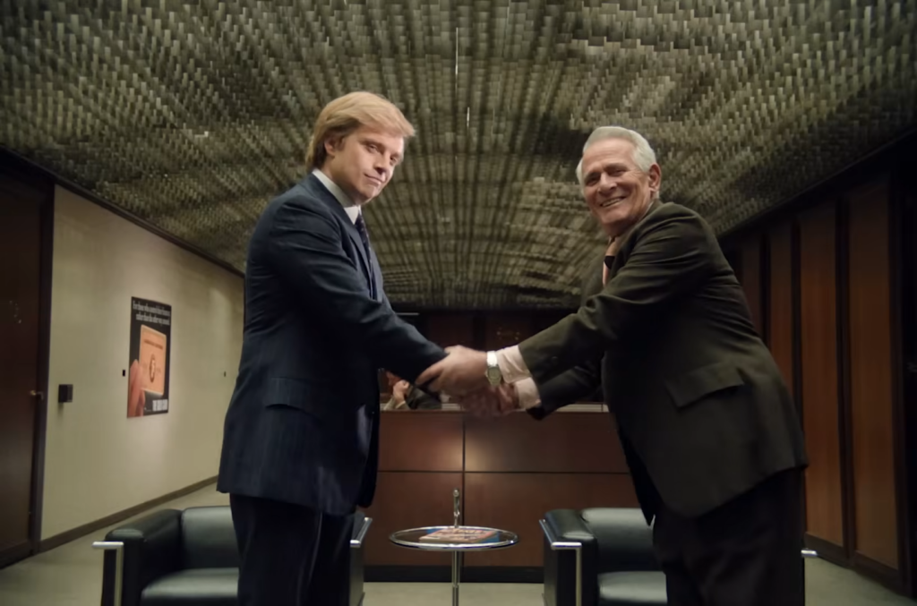 Donal Trump makes a deal with American Express in a scene from The Apprentice (2024)