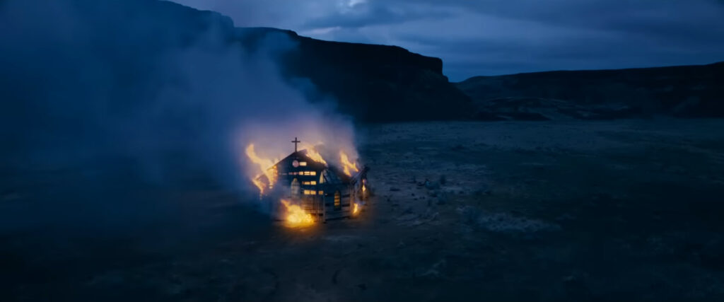 A shot of a burning church from Passenger (2026)